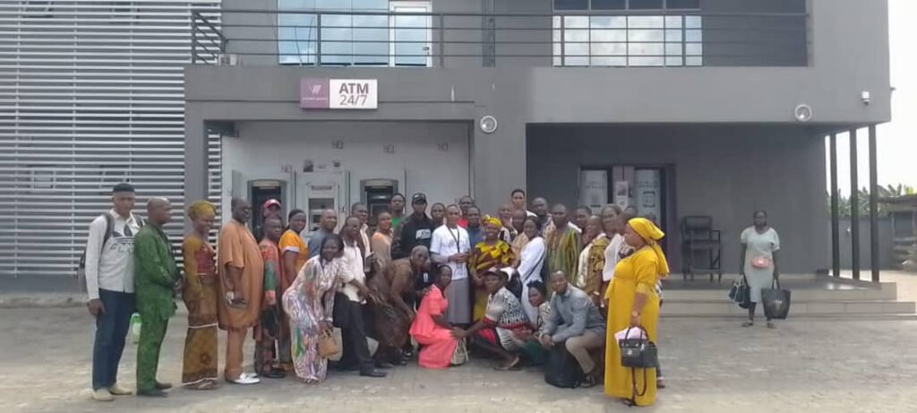 What we do Group photograph outside an ATM building